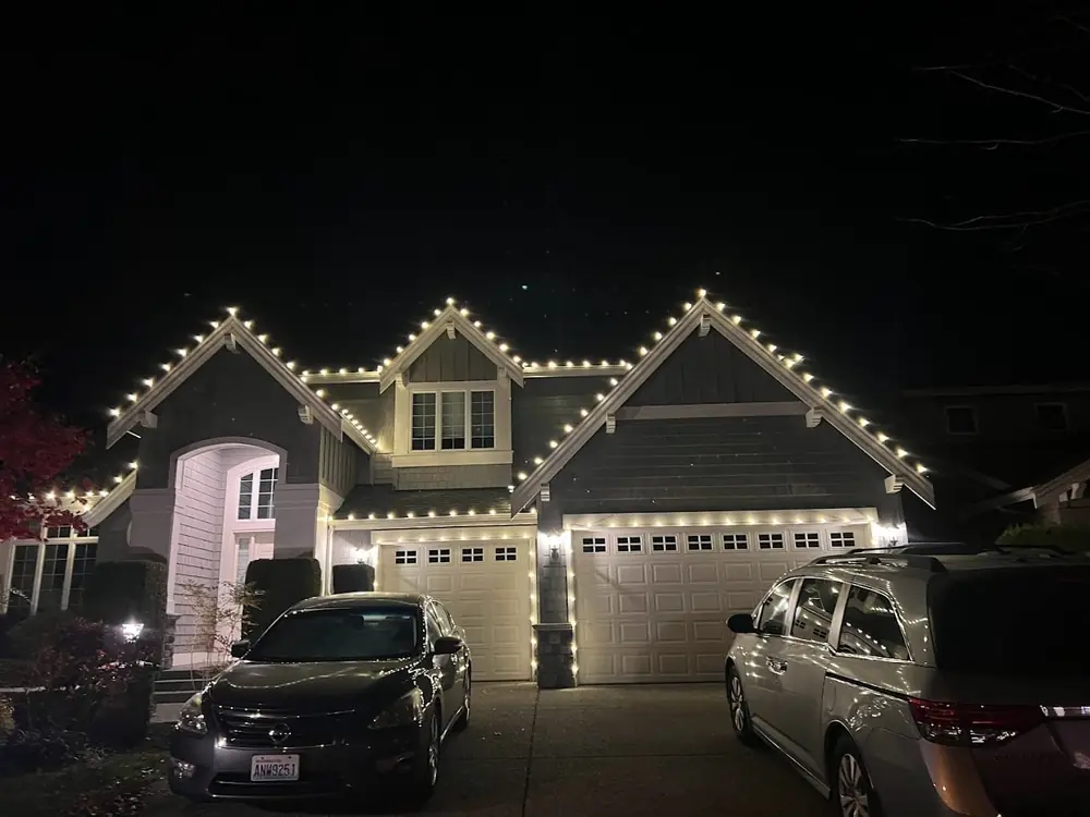 Every gable and the garage outlined in warm white lights
